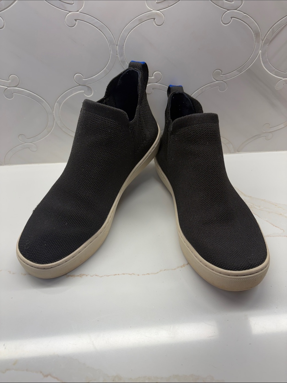 Rothy's Black Slip-On Knit Sneakers with Blue Heel Tab